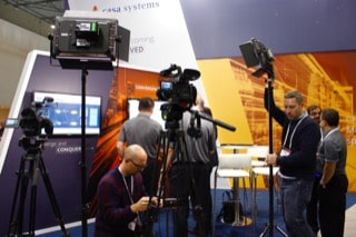 camera-crew is setting up camera for interview at MWC2019 in Barcelona