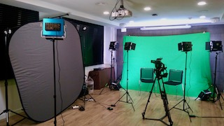 green-screen interview filming set with camera and lighting in Barcelona