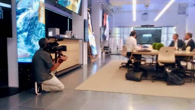 cameraman filming work meeting