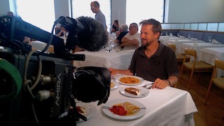 filming table scene for science documentary in Madrid