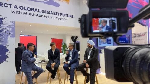 Camera with panelists in the background