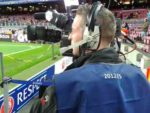 bilingual cameraman at Champions League match Spain